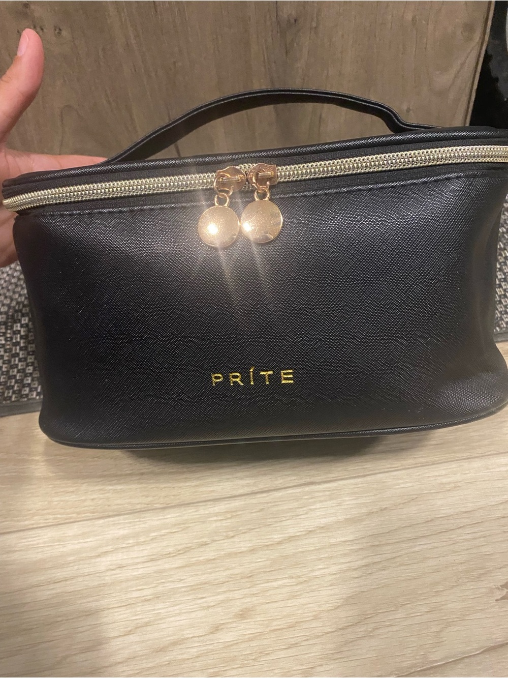 Black Top-Handle Cosmetic Bag with Gold Accents